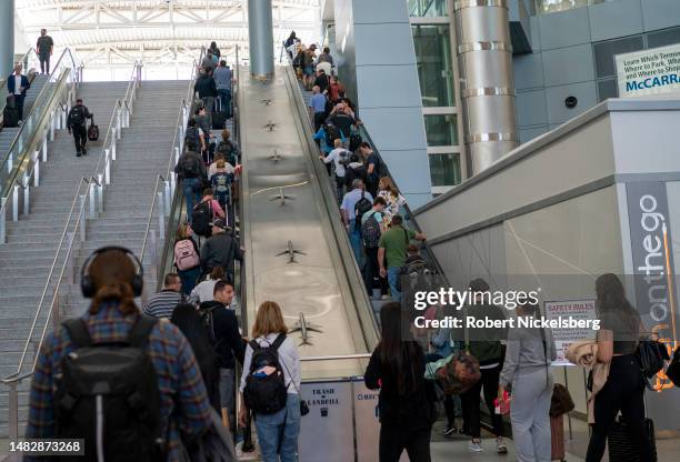 Airline passengers move to their flights April 16, 2023 at the Harry Reid International Airport in Las Vegas, Nevada. In 2022, Las Vegas had an...