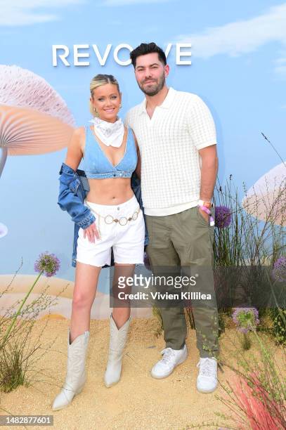 Hannah Godwin and Dylan Barbour attend REVOLVE Festival 2023, Thermal, CA - Day 2 on April 16, 2023 in Thermal, California.