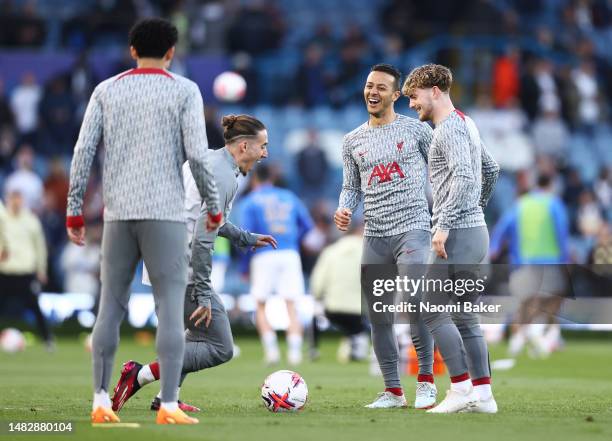 Thiago Alcantara of Liverpool laughs with teammates during warm ups prior to the Premier League match between Leeds United and Liverpool FC at Elland...