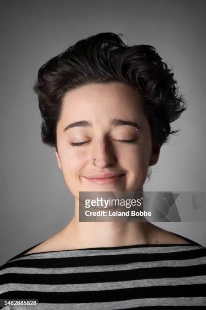 studio portrait of young adult non-binary person - androgyn stock pictures, royalty-free photos & images
