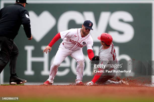 Christian Arroyo of the Boston Red Sox tags out Shohei Ohtani of the Los Angeles Angels during the sixth inning at Fenway Park on April 17, 2023 in...