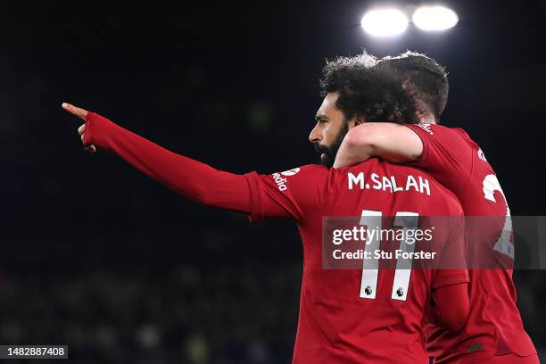 Mohamed Salah of Liverpool celebrates with teammate Andrew Robertson after scoring the team's second goal during the Premier League match between...