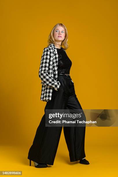 fashionable woman in suit - checked trousers stock pictures, royalty-free photos & images