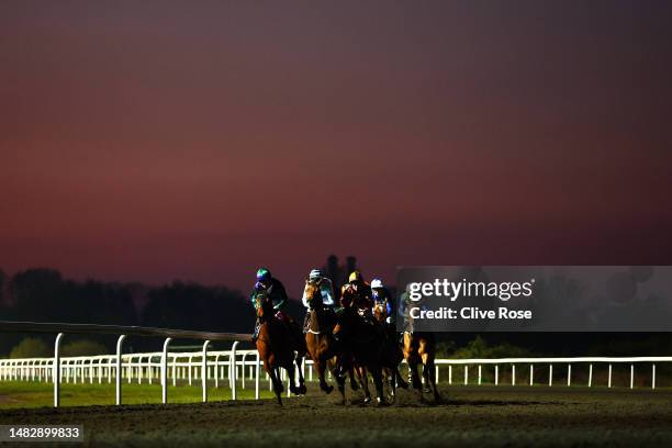 Runners and riders compete in the 25% Boost On Darts Profits Handicap Stakes at Kempton Park on April 17, 2023 in Sunbury, England.