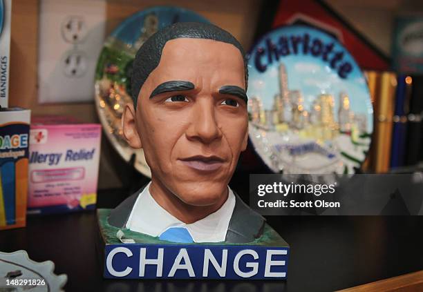 President Barack Obama bank is displayed for sale at Sundries in the EpiCenter on July 10, 2012 in Charlotte, North Carolina. The EpiCentre is a hub...