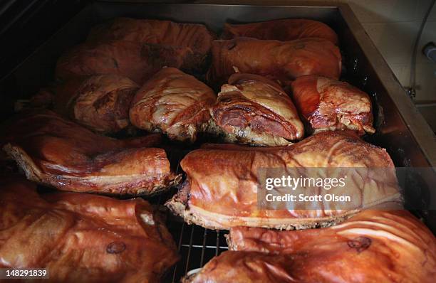 Quartered pigs are smoked at Bill Spoon's Barbecue on July 12, 2012 in Charlotte, North Carolina. The nearly fifty-year-old restaurant, founded by...