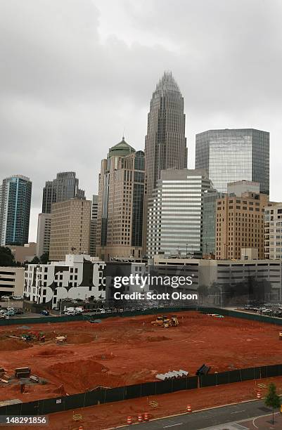 The Bank of America Corporate Center building, which houses the corporate headquarters for Bank of America, rises above the Charlotte skyline on July...