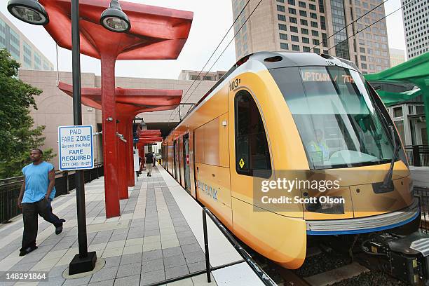 Passengers catch a ride on the LYNX light rail subway system on July 11, 2012 in Charlotte, North Carolina. LYNX is a 9.6-mile light rail line...