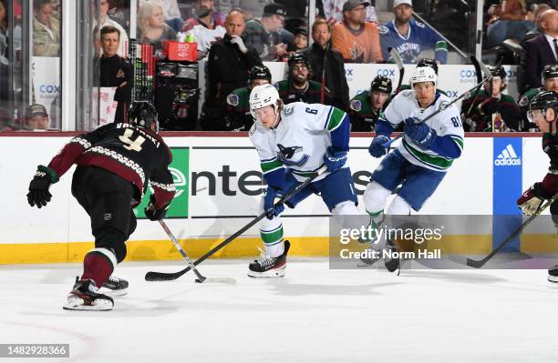 Brock Boeser of the Vancouver Canucks skates with the puck against the Arizona Coyotes at Mullett Arena on April 13, 2023 in Tempe, Arizona.