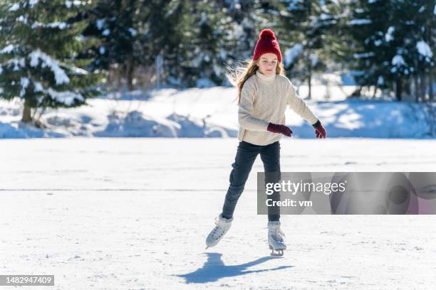 girl ice skating on frozen lake - frozen lake stock pictures, royalty-free photos & images