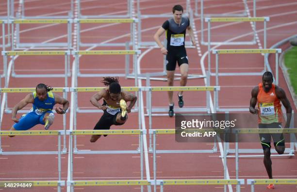 Althete Aries Merritt and US althete Jason Richardson jump hurdles as Britain's Andrew Pozzi stops after clipping a hurdle during the men's 110m...