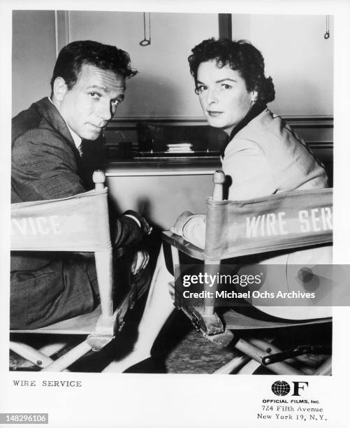 Dane Clark and Mercedes McCambridge sitting in director chairs from the television series 'Wire Service', 1956.