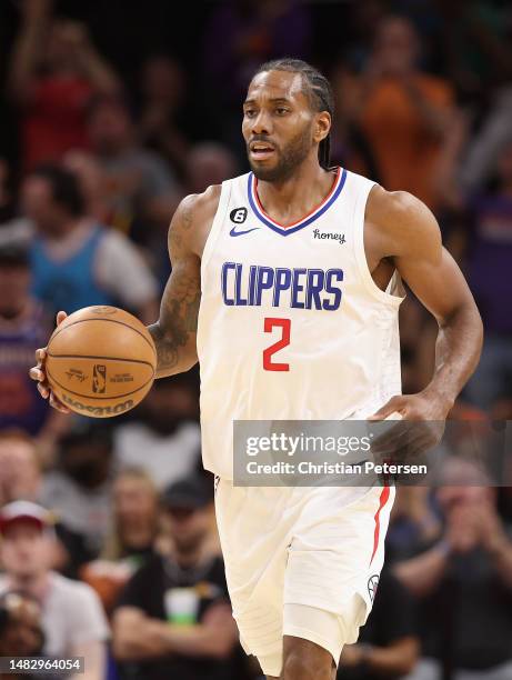 Kawhi Leonard of the LA Clippers handles the ball during Game One of the Western Conference First Round Playoffs at Footprint Center on April 16,...