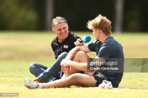 Former player Tim Horan speaks with Max Jorgensen during an Australia Wallabies training camp at Sanctuary Cove on April 18, 2023 in Gold Coast,...