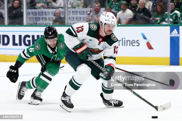 Sam Steel of the Minnesota Wild scores a goal against Jake Oettinger of the Dallas Stars and Colin Miller of the Dallas Stars in the second period in...