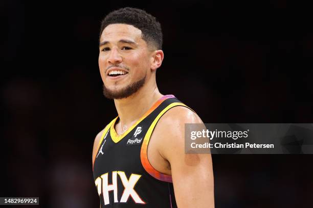 Devin Booker of the Phoenix Suns reacts during Game One of the Western Conference First Round Playoffs at Footprint Center on April 16, 2023 in...