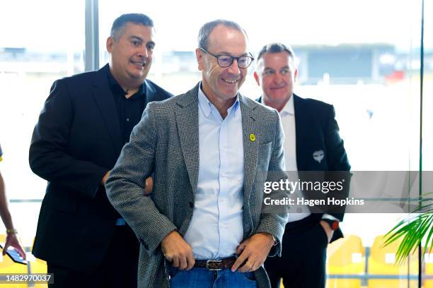 To R, Newly appointed Head Coach Giancarlo Italiano, Phoenix Chairman Rob Morrison and Director of Football Shaun Gill arrive during a media...