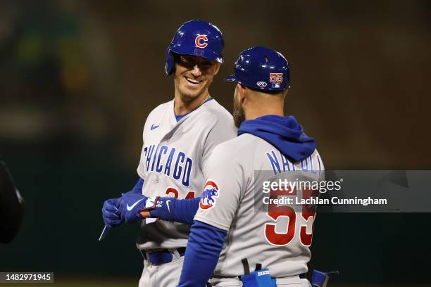 Cody Bellinger of the Chicago Cubs reacts after reaching first base on a fly ball in the top of the fifth inning against the Oakland Athletics at...