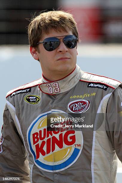 Landon Cassill, driver of the Burger King/Dr Pepper Toyota, looks on during qualifying for the NASCAR Sprint Cup Series LENOX Industrial Tools 301 at...