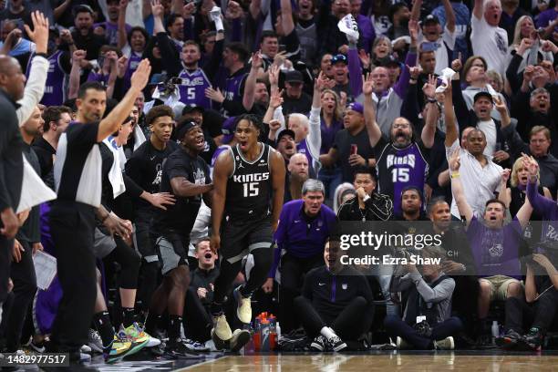 Davion Mitchell of the Sacramento Kings reacts after he made a three-point basket against the Golden State Warriors in the fourth quarter during Game...