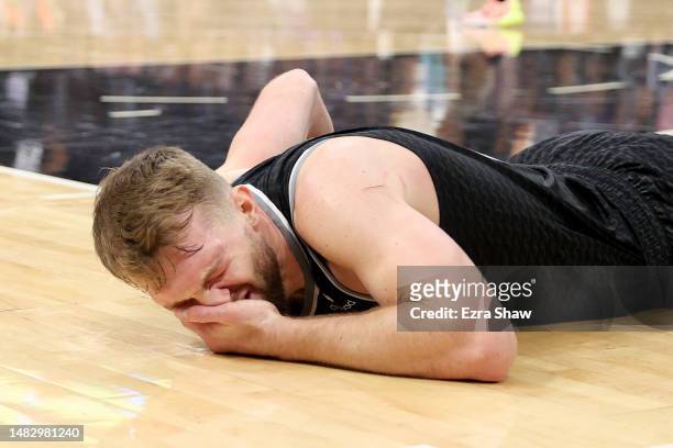 Domantas Sabonis of the Sacramento Kings reacts to being hit in the face against the Golden State Warriors in the first half of Game Two of the...