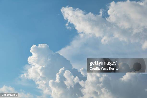 white clouds in a blue sky in summer - 入道雲 ストックフォトと画像