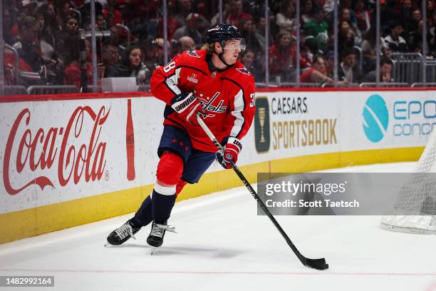 Rasmus Sandin of the Washington Capitals skates with the puck against the New Jersey Devils during the first period of the game at Capital One Arena...