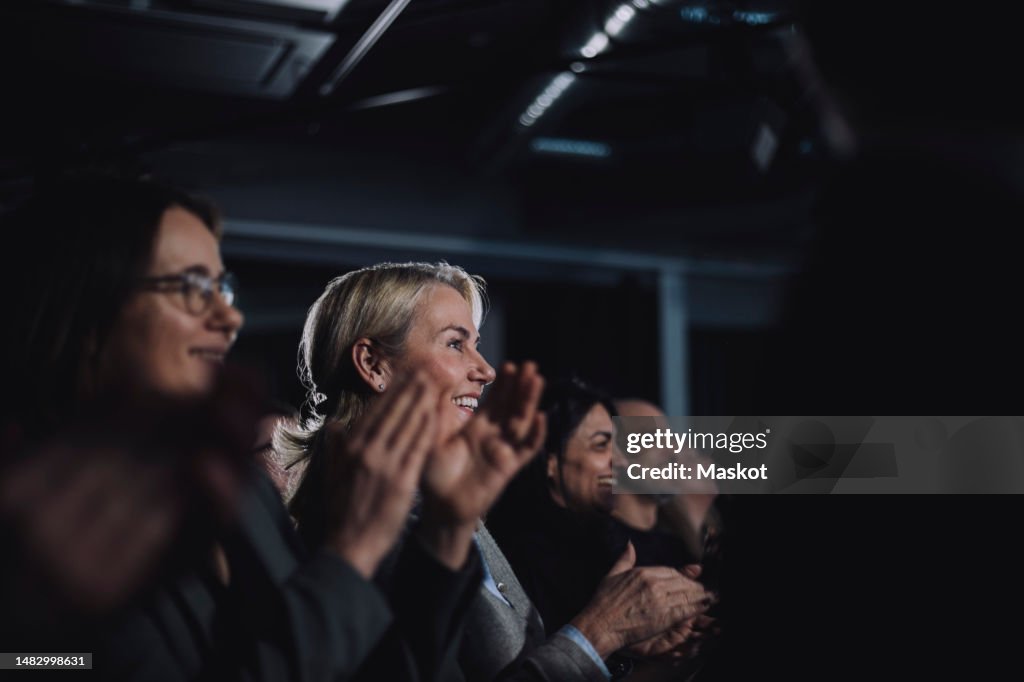 Happy audience applauding during tech event seminar