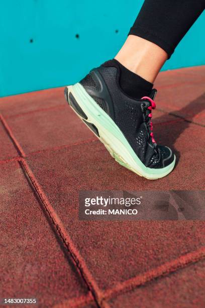 athlete runner foot, closeup on shoe. - leg stretch girl stock pictures, royalty-free photos & images