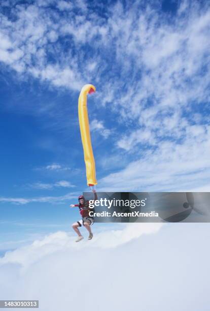 skydiver in free fall with colourful streamer - stunt person stock pictures, royalty-free photos & images