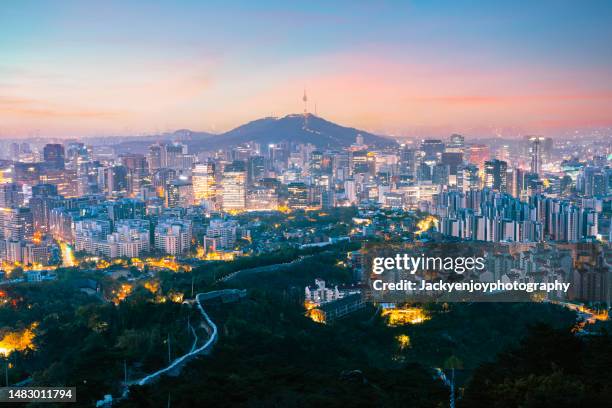 the n seoul tower at namsan park in the morning twilight sky. the best view and trek from inwangsan mountain in seoul, south korea. - namsan seoul stock pictures, royalty-free photos & images