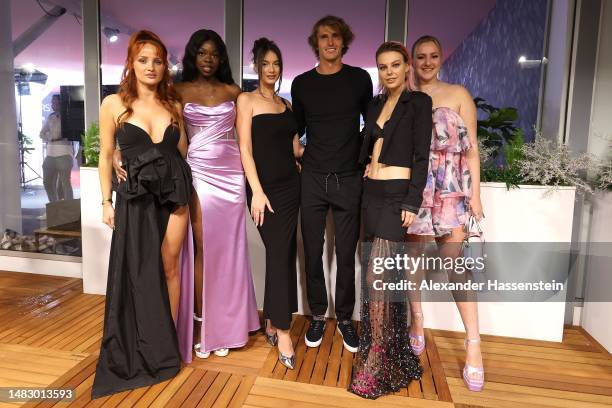 Alexander Zverev of Germany poses with models for a family picture during the BMW Open by American Express Players Night 2023 on day three of the BMW...