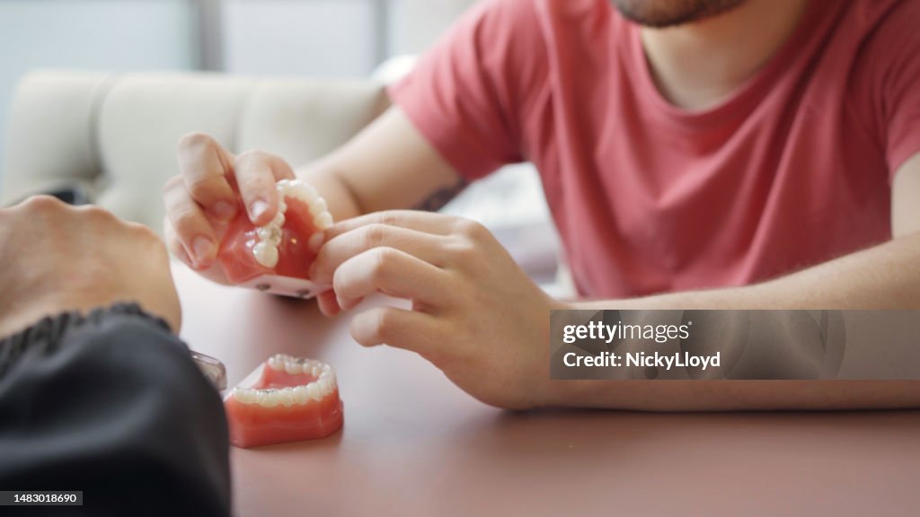 Patient speaking with a dentist during a consultation