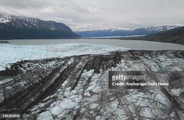 Aerial view from an Alaska Army National Guard UH-60L Black Hawk helicopter of Colony Glacier, foreground, as it flows towards Inner Lake George and...