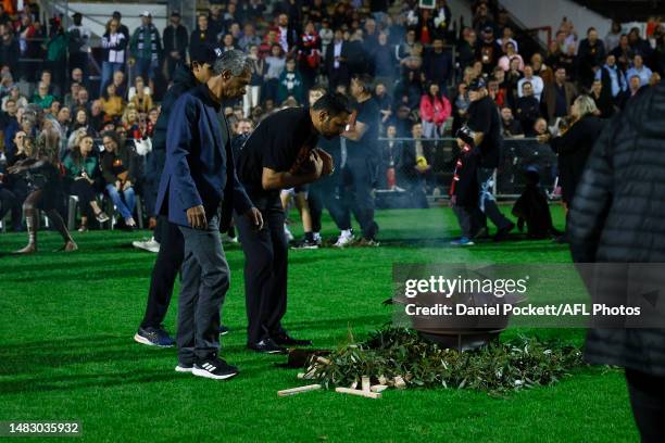 Nathan Lovett Murray and Gilbert McAdam take part in a smoking ceremony during Ngarra Jarra Noun Healing Ceremony at Victoria Park on April 18, 2023...