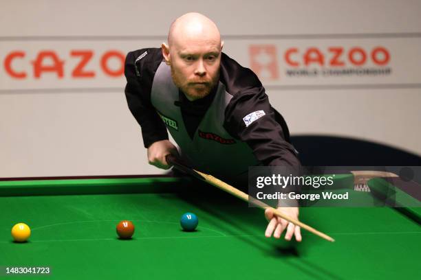 Gary Wilson of England plays a shot during their round one match against Elliot Slessor of England on Day Four of the Cazoo World Snooker...