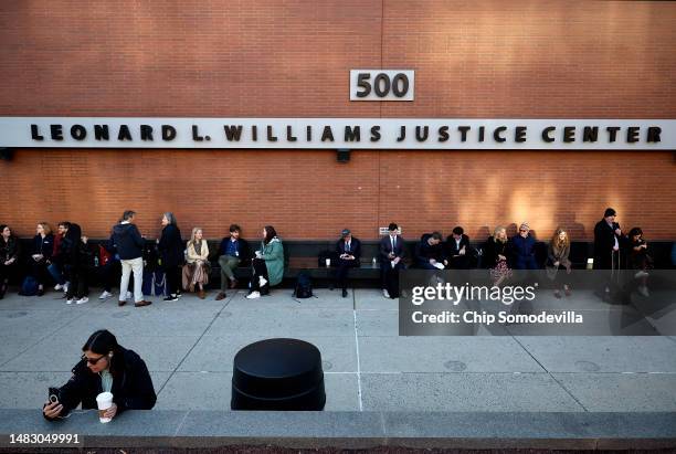 Reporters and members of the public line up early to enter the Leonard Williams Justice Center where Dominion Voting Systems is suing FOX News in...
