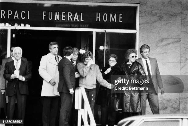 Mourners leave the Scarpaci Funeral Home in Brooklyn, New York, following a service for murdered Gambino crime family underboss Frank DeCicco on...
