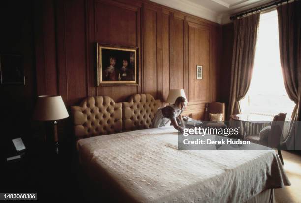 Cleaning staff prepare rooms for guests at Cliveden House, a five-star hotel and spa in Buckinghamshire, England, March 1990.