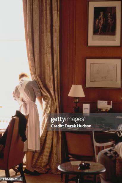 Cleaning staff prepare rooms for guests at Cliveden House, a five-star hotel and spa in Buckinghamshire, England, March 1990.