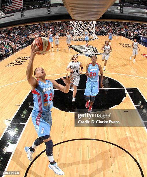 July 13: Armintie Price of the Atlanta Dream shoots against the San Antonio Silver Stars at the AT&T Center on July 13, 2012 in San Antonio, Texas....
