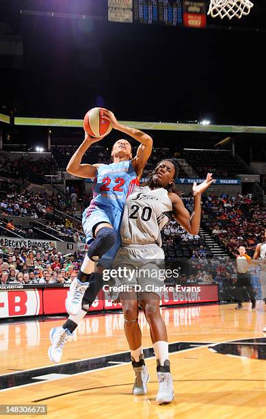 July 13: Armintie Price of the Atlanta Dream shoots against Shameka Christon of the San Antonio Silver Stars at the AT&T Center on July 13, 2012 in...