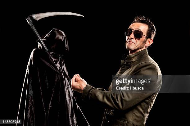 Rocker Biker Making Fun Of Grim Reaper High-Res Stock Photo