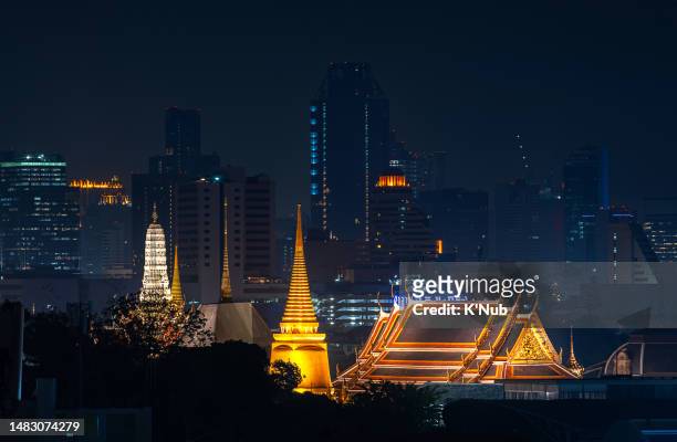 golden buddha stupa temple in center of bangkok city, thailand with modern business office on high building or skyscrapper skyline in downtown of bangkok city thailand east of asian - k'nub stock pictures, royalty-free photos & images