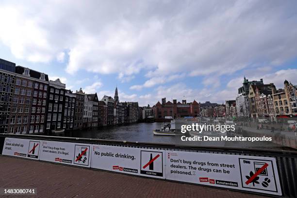 General view of the city centre including the Red Light District, also called "De wallen" by locals and some street signs with 'Geen alcohol op...