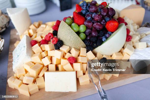 fruits and cheeses are ready to be snacked upon - cheese cubes stock pictures, royalty-free photos & images