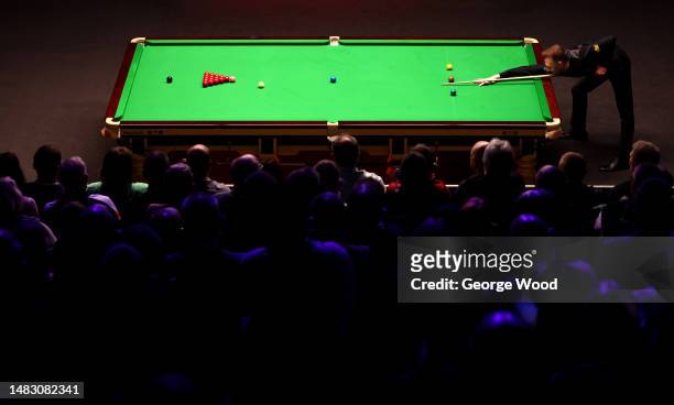 Judd Trump of England plays a shot during their round one match against Anthony McGill of Scotland on Day Four of the Cazoo World Snooker...