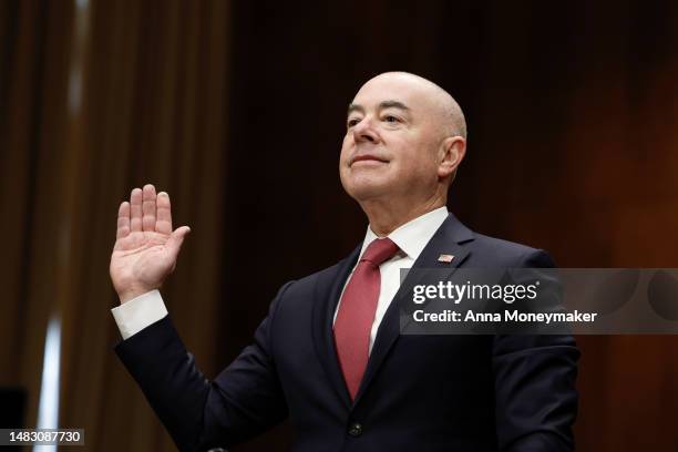 Secretary of Homeland Security Alejandro Mayorkas is sworn in before the start of a hearing with the Senate Homeland Security Committee in the...