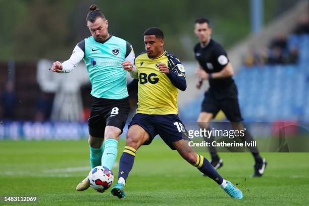 Marcus McGuane of Oxford United battles for possession with Ryan Tunnicliffe of Portsmouth during the Sky Bet League One match between Oxford United...