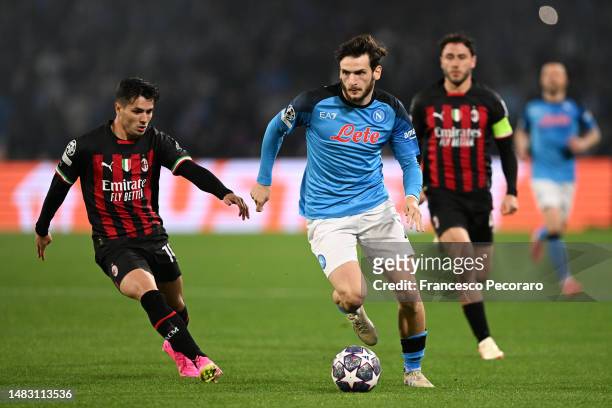 Khvicha Kvaratskhelia of SSC Napoli runs with the ball whilst under pressure from Brahim Diaz of AC Milan during the UEFA Champions League...
